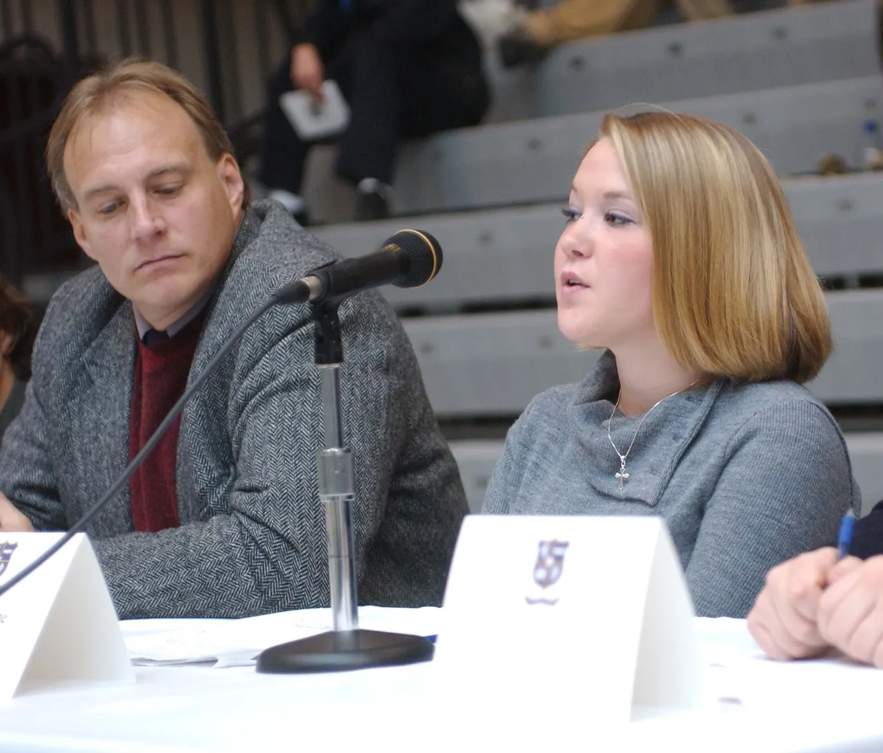 Mary Katherine Branham, a member of the student panel, asks Mr. Mudd a question after his presentation while Skip Saunders, English instructor, waits his turn.