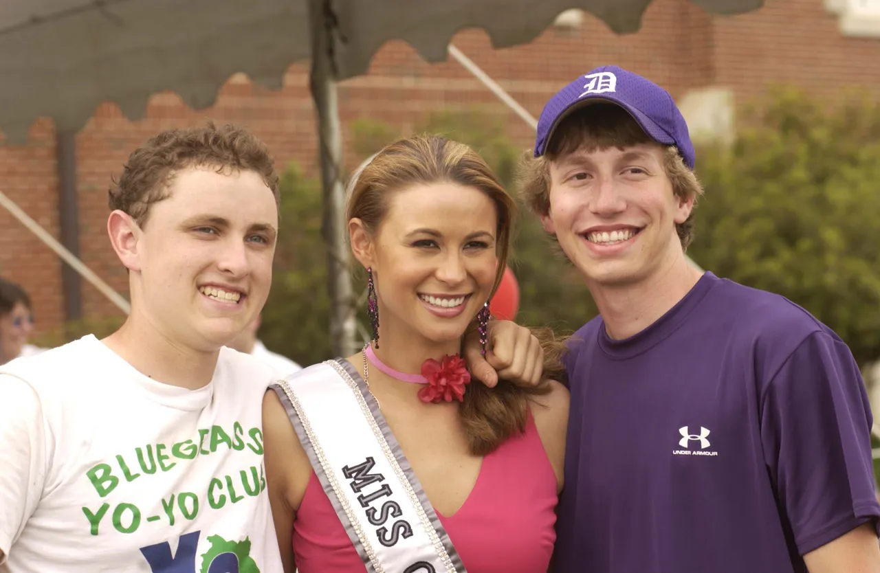 Sophomore Alex Dunlap and junior Bradley Large welcome Miss Georgia to Darlington during her appearance at the Tour de Georgia.
