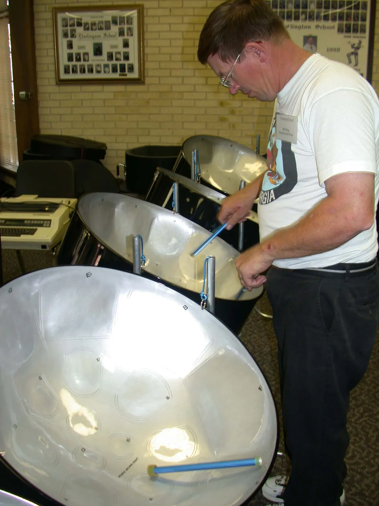 Bill King, who has taught Instrumental Music at Darlington since 1997, is conducting a second-period steel drum class and an after-school activity.