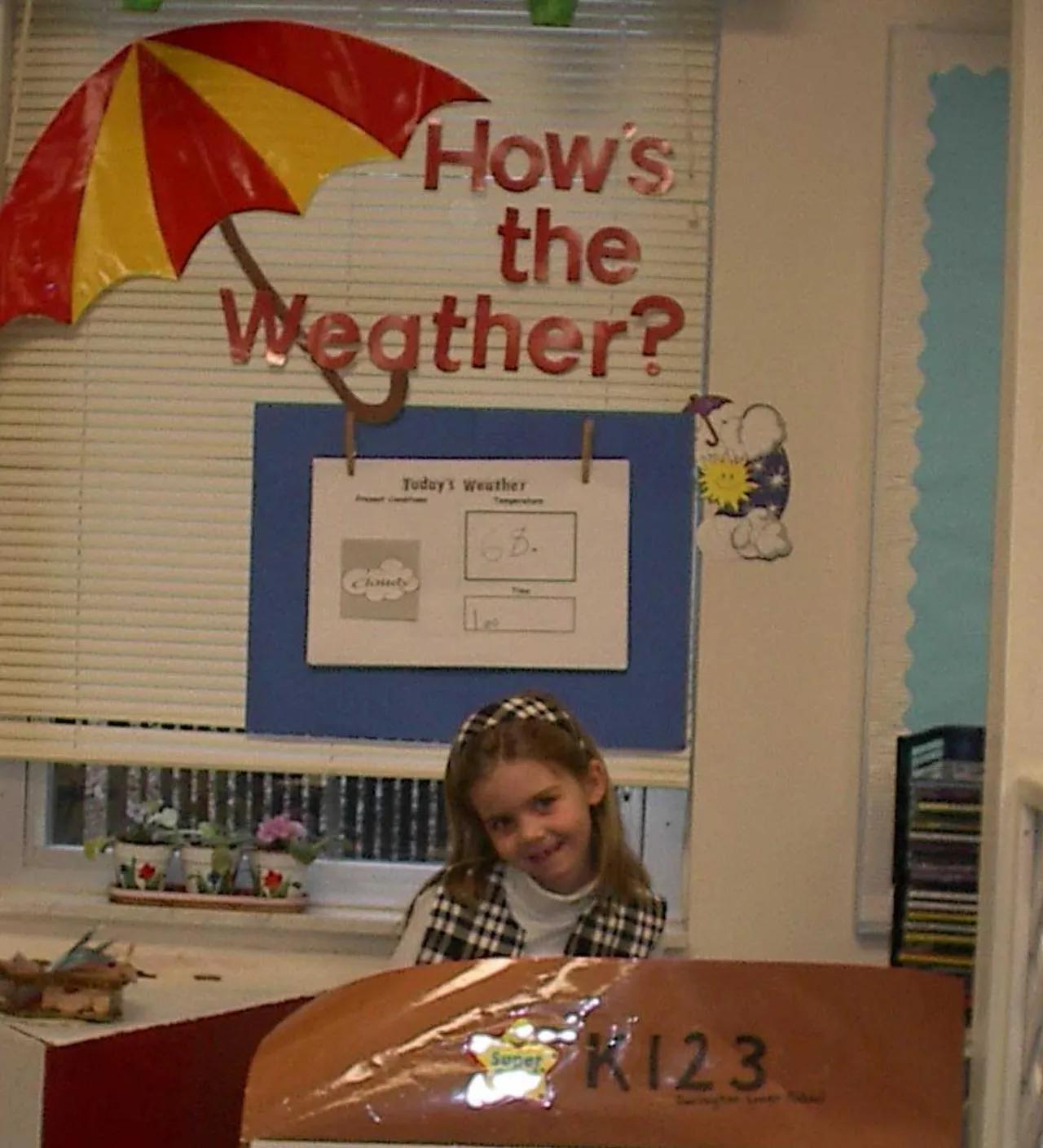 Ally Taylor forecasts the weather for the kindergarten class.