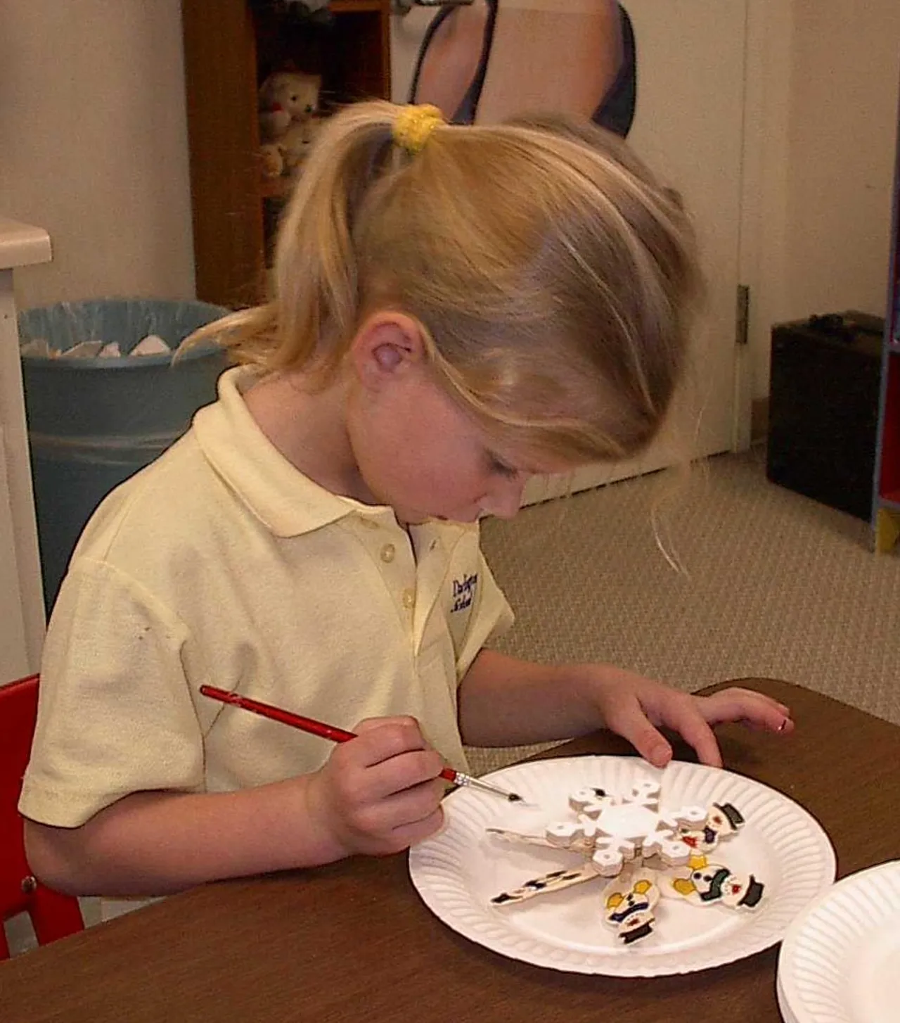 Elizabeth Wilhoite works on her painting project.