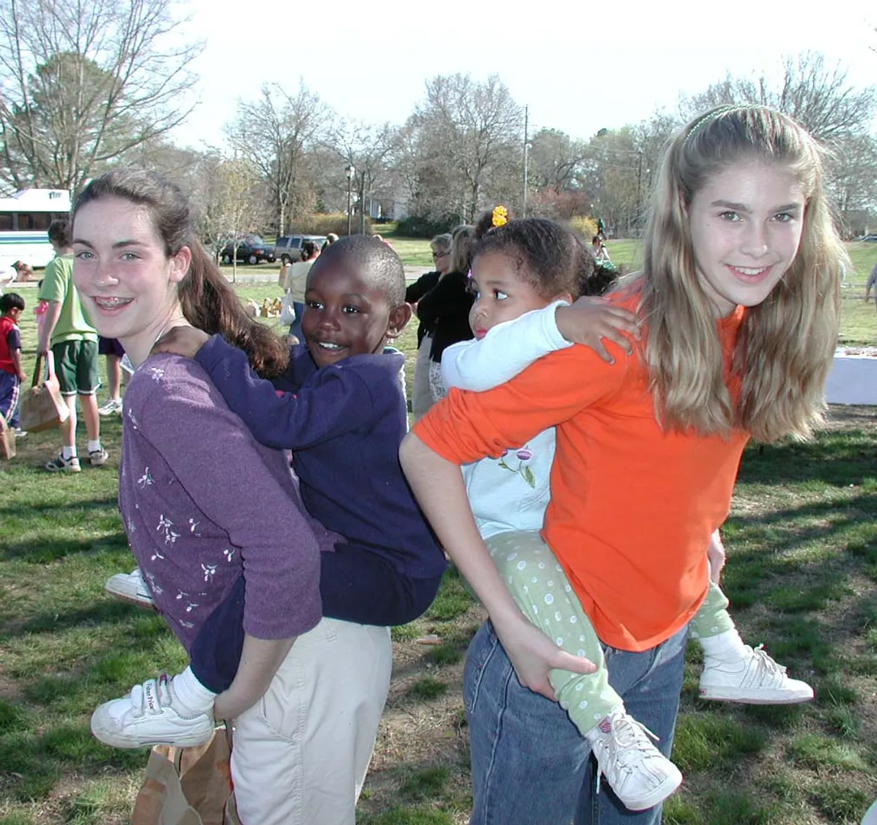 Eighth-graders Bethany Blevins and Quincy Matthews help search for eggs.