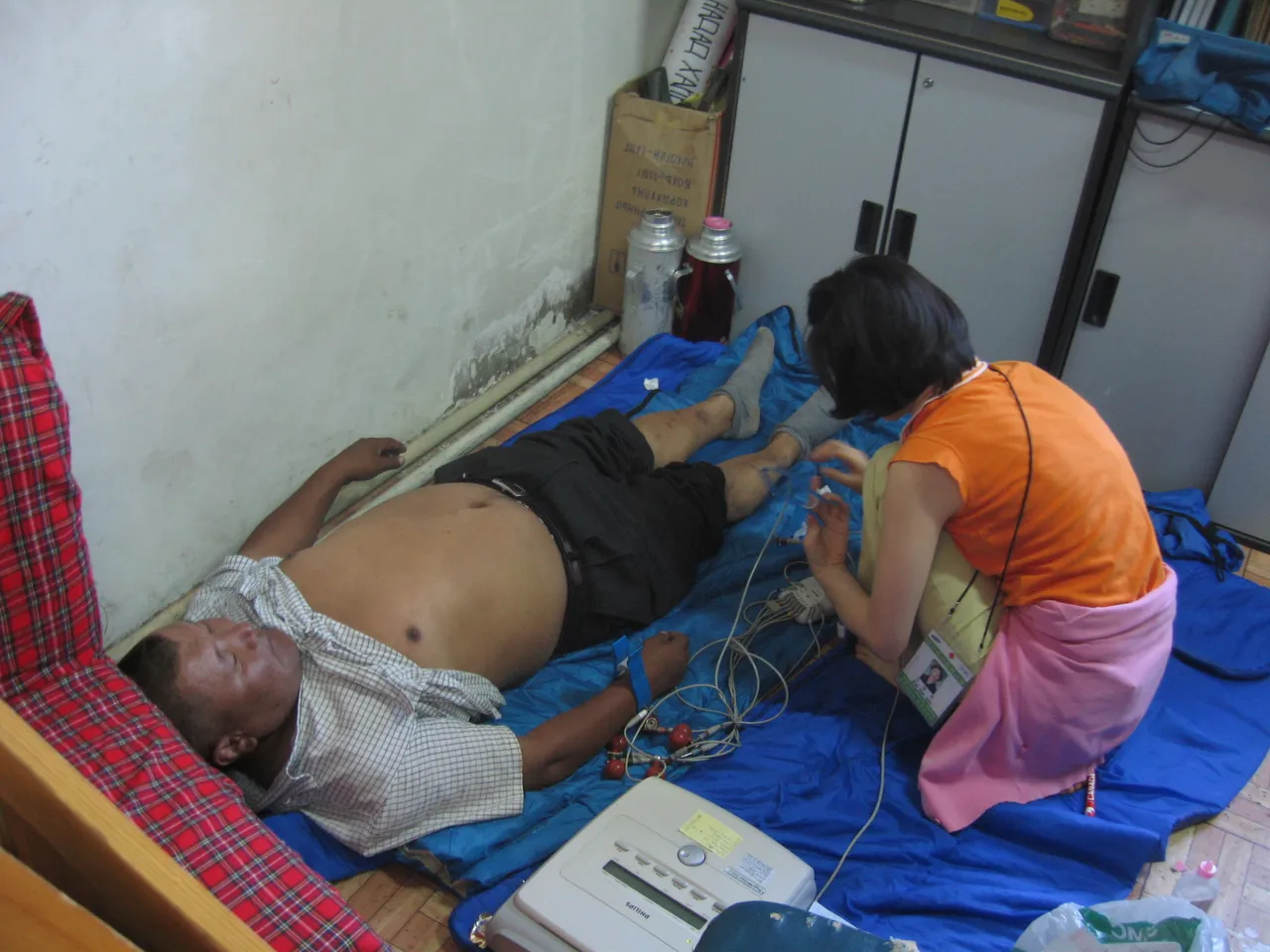 A patient is seen by a member of the medical team.