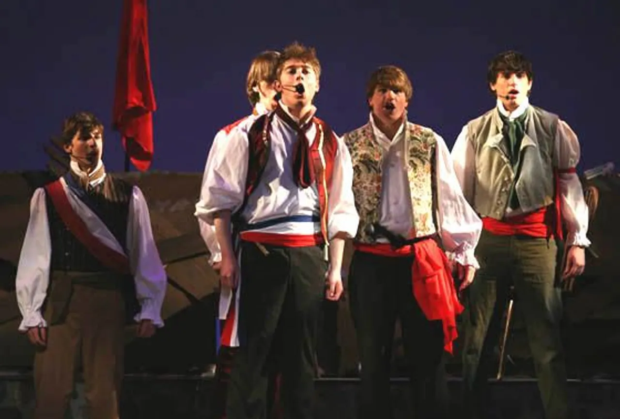 Logan O'Riley (center) in "Les Miserables."