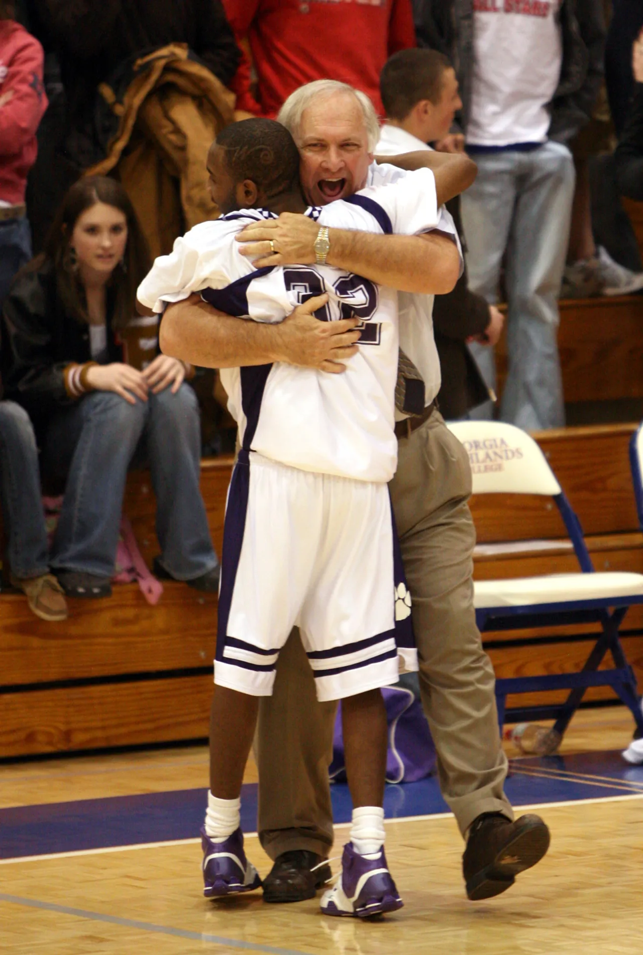 Head Coach Jim Van Es hugs Corey Roper after the game.