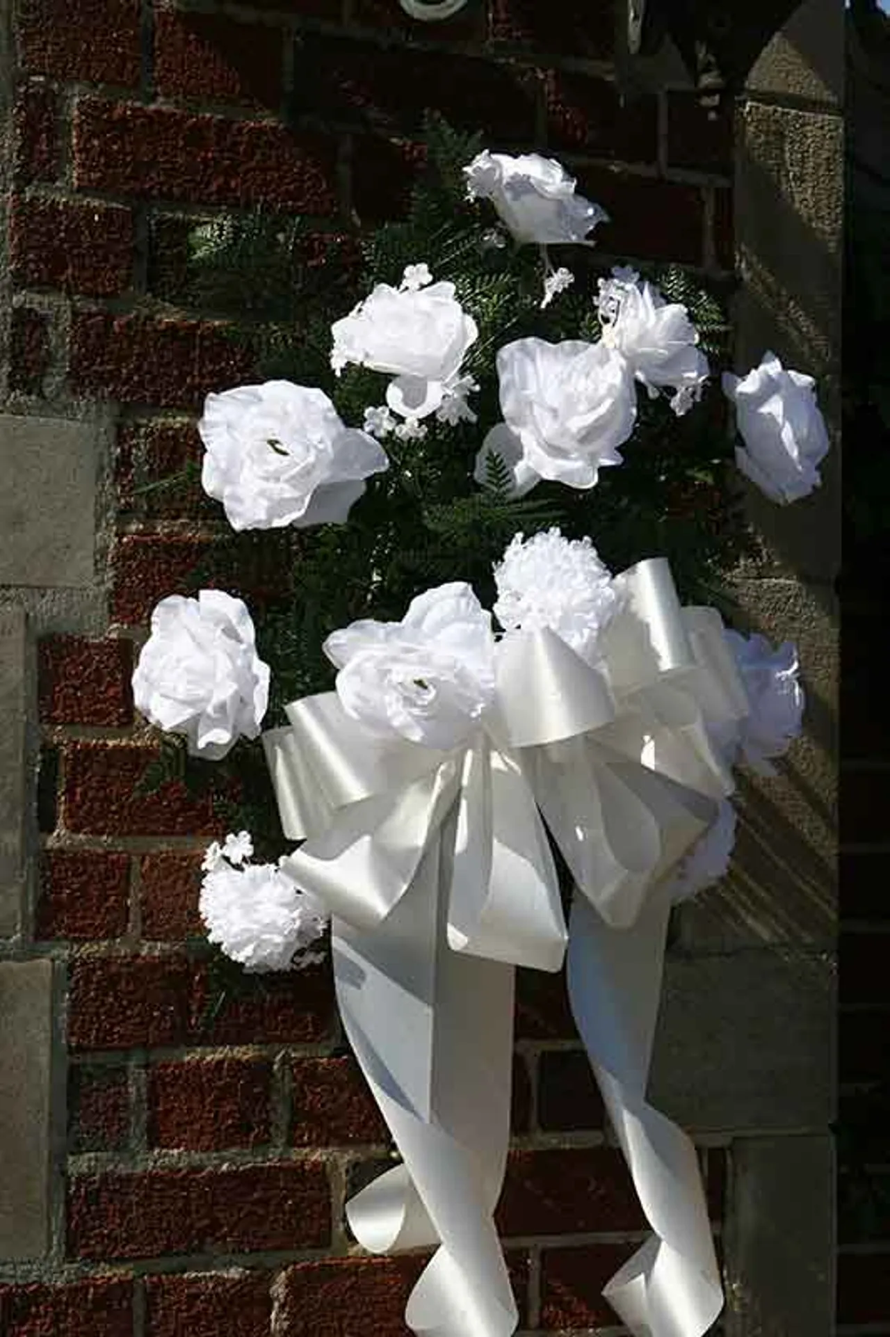 Wreaths are hung at the gates of Darlington School in memory of Clay McKemie and Sean Wilkinson.
