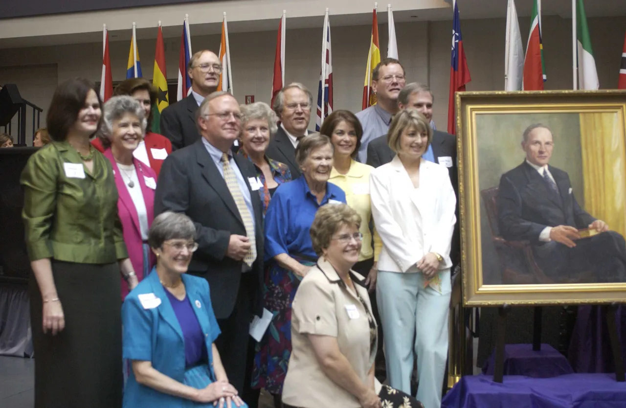 The McCain family gathered with a portrait of Dr. James Ross McCain that was unveiled and dedicated during the Convocation.