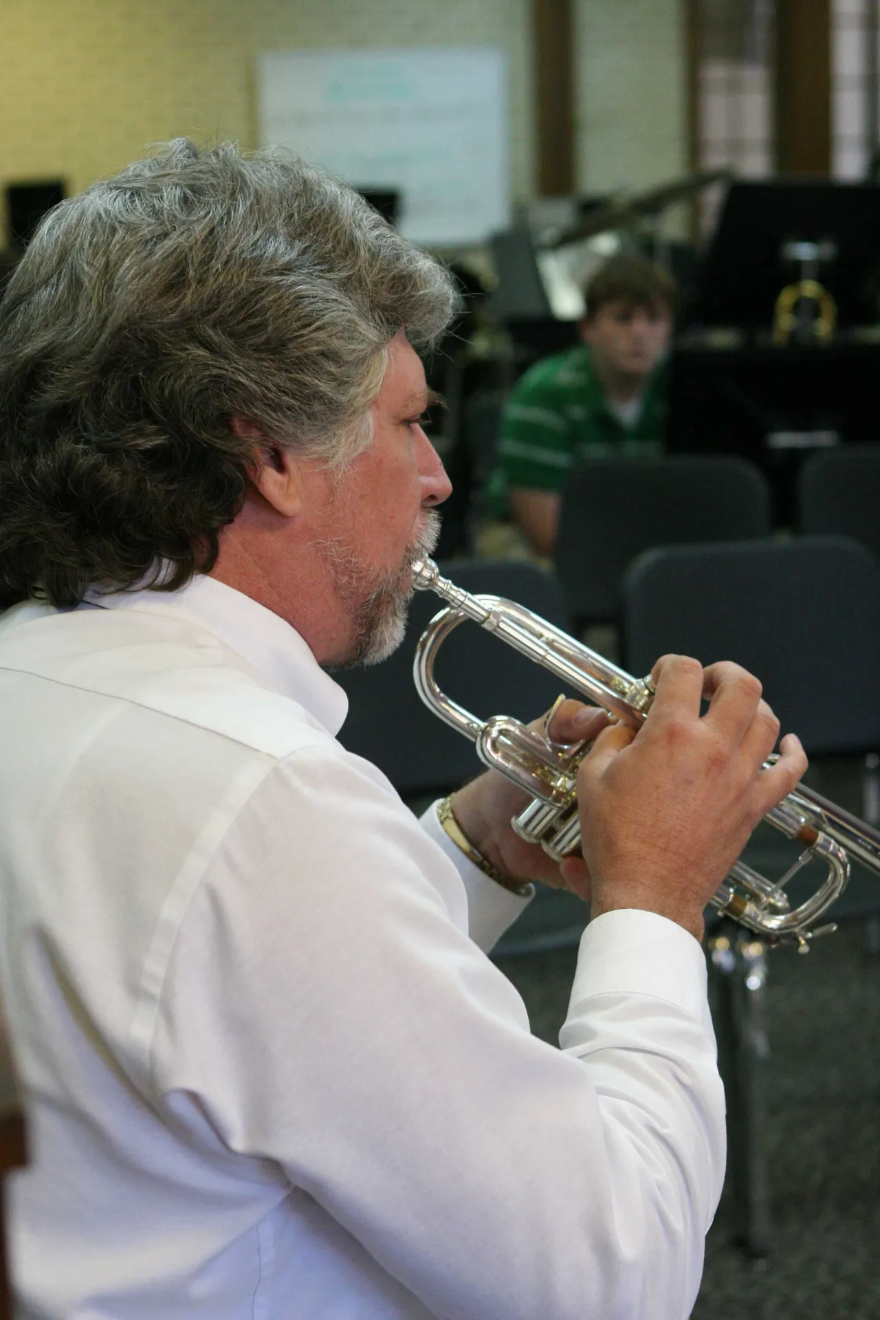 Dr. Tom Smith works with trumpet players