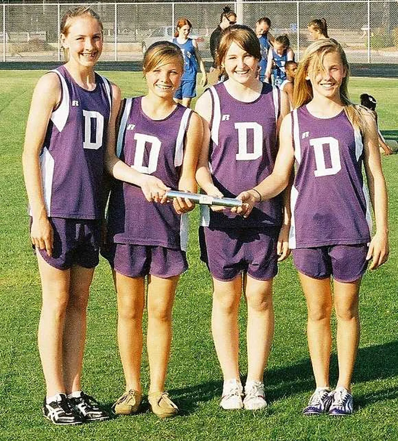 4x100 girls: From left – Anna Swafford, Lauren Phillips, Lauren O’Neal and Carolyn Kipp are all smiles after breaking the girls 4x100 relay record.