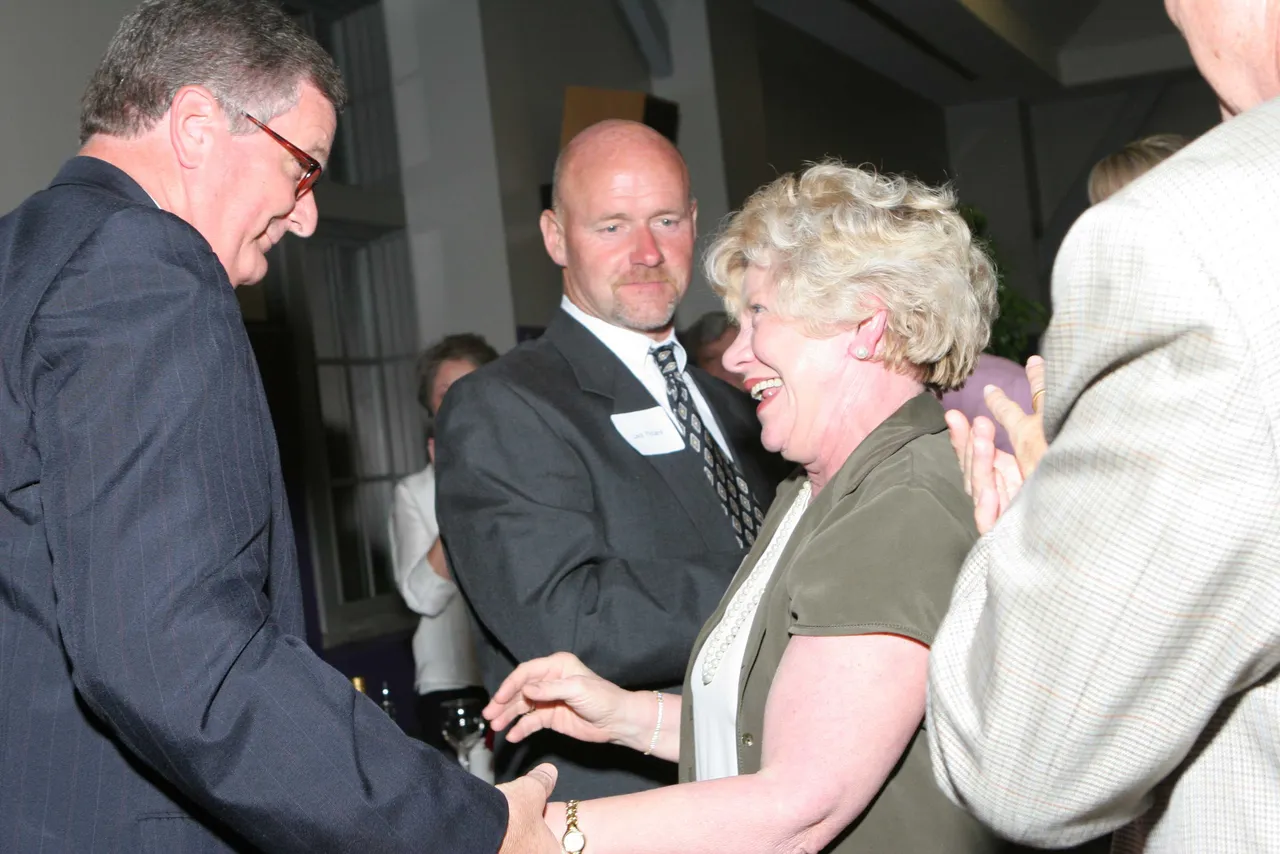 Former Upper School administrator David Rhodes congratulates Nan Gray on her service to Darlington.