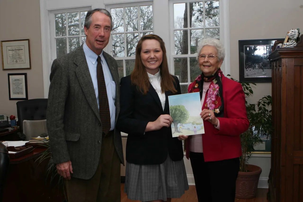 Headmaster Tom Whitworth, senior Adrienne Hamil and Hilda Moore