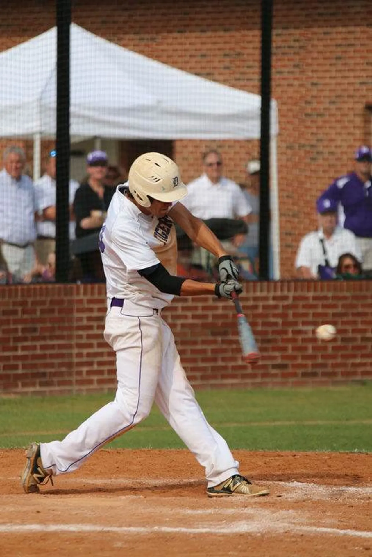 Sophomore Sam Hunt connects with the ball during the Tigers’ doubleheader Tuesday against Greater Atlanta Christian. (Photo credit: Tyler Greenawalt / Rome News-Tribune)
