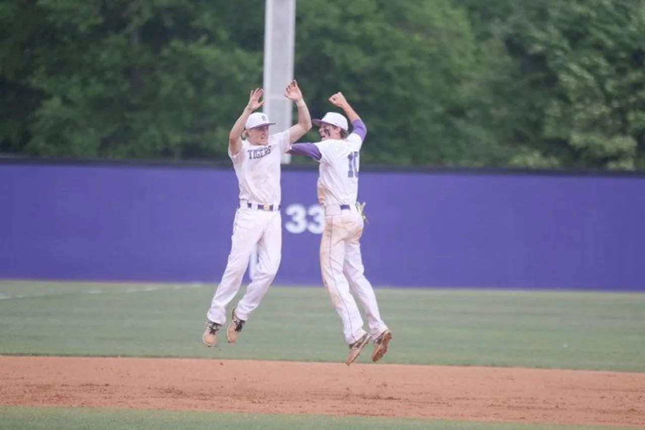 Seniors Tripp Flournoy (left) and Seth Little celebrate after the Tigers’ 12-2 win over Rabun County. (Photo credit: Tyler Greenawalt / Rome News-Tribune)