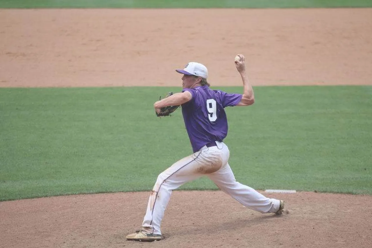 Senior Burton Dulaney delivers a pitch during Monday's game against Wesleyan. (Photo credit: Jim Alred / Rome News-Tribune)