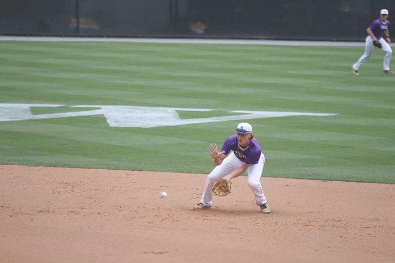 Junior Jake Maxwell fields a ball during the Tigers' loss to Wesleyan in the Class AA State Finals on Monday afternoon.  (Photo credit: Jim Alred / Rome News-Tribune)