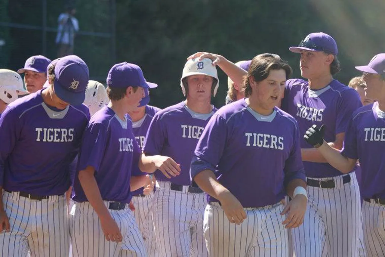 Darlington teammates celebrate with Jay Shadday (center) after his two-run homer in the seventh. (Photo credit: Tyler Greenawalt / Rome News-Tribune)