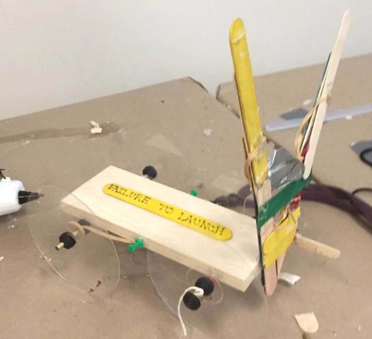 Despite its professional appearance, my team of three constructed this beauty using only hot glue, (again, scars) CD’s, popsicle sticks, balsa work, rubber bands, axels, and duct tape. Though admirable, her performance fell short of a victory.