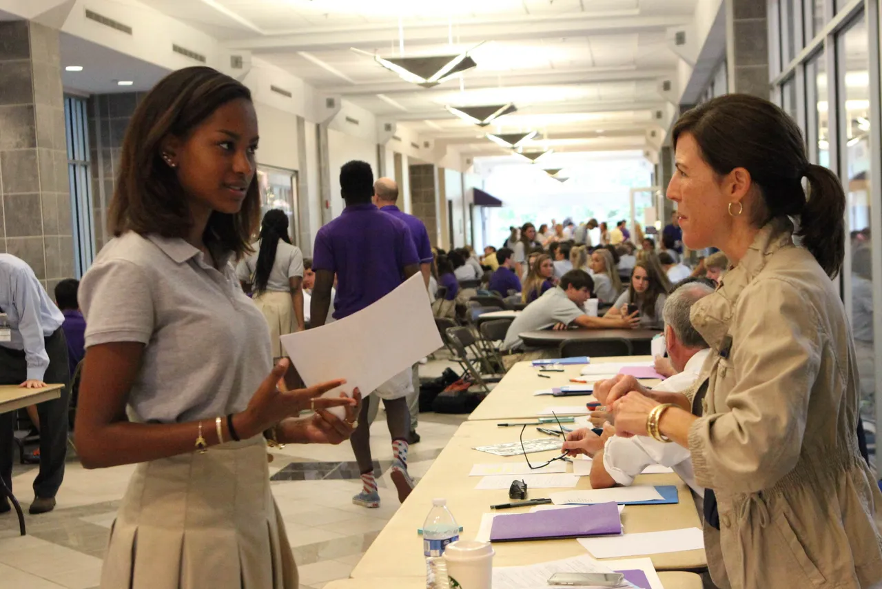 Amber Rodriguez gets input on her practice college application from adviser Dana Peek.