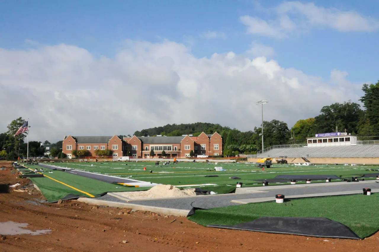 The turf field at Chris Hunter ('82) Memorial Stadium nears completion during the last week of Darlington's summer break.