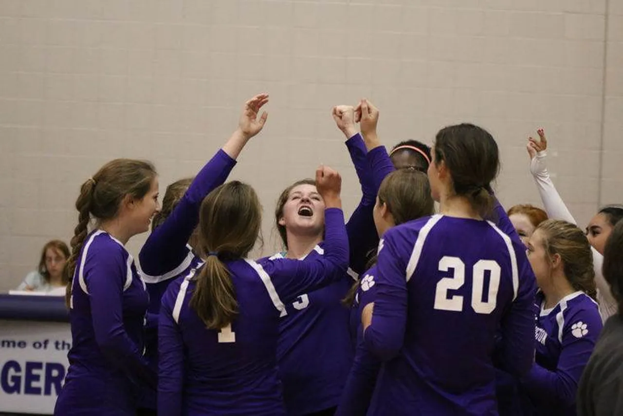 Volleyball teammates celebrate victory after defeating Coosa 25-8, 25-17 on September 15, 2015. (Photo credit: Tommy Romanach/RN-T.com)