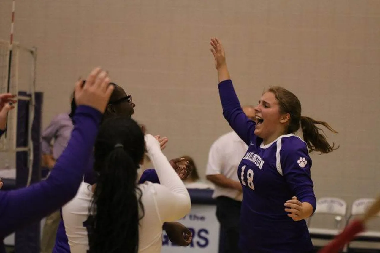 Senior Zoe Smith celebrates with her teammates after the Tigers defeated Coosa 25-8, 25-17 on Sept. 15, 2015. (Photo credit: Tommy Romanach/RN-T.com)