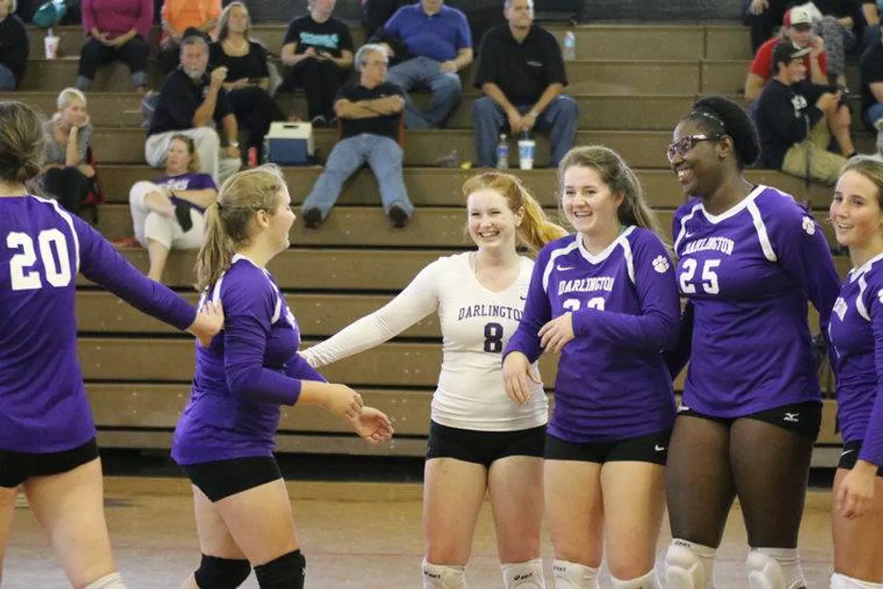Darlington volleyball teammates celebrate a point during the team's 25-15, 25-15 win against Temple on Sept. 29, 2015. (Photo credit: Tommy Romanach/RN-T.com)