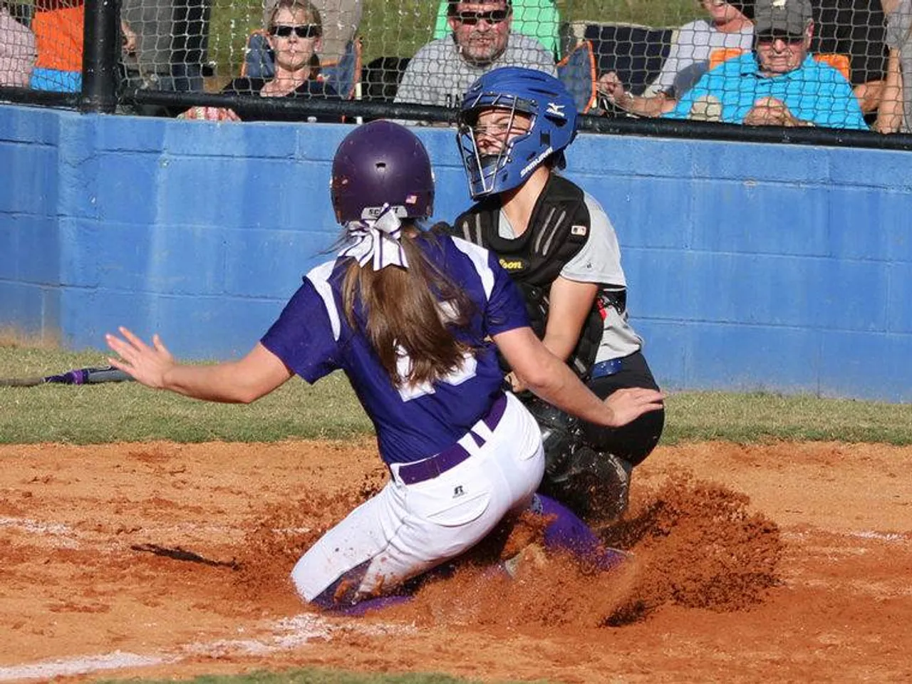 Sophomore Alex Gardner (left) slides into Model catcher Destiny Womack during a play at home plate in a game Wednesday, Sept. 30, 2015, at Model. Gardner was called out. (Photo credit: Jeremy Stewart/RN-T.com)