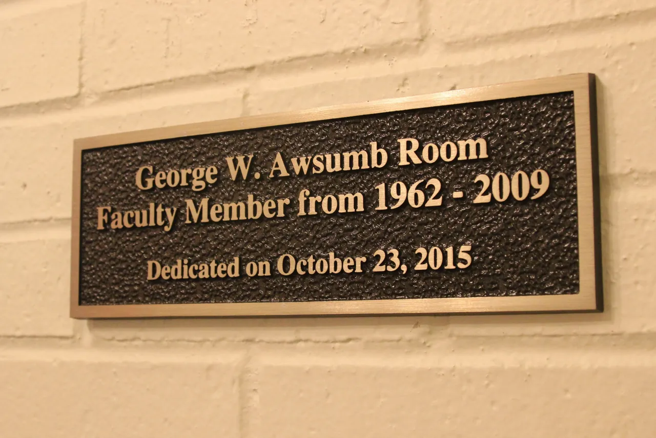 A new plaque was unveiled on Friday outside of the George W. Awsumb Room.