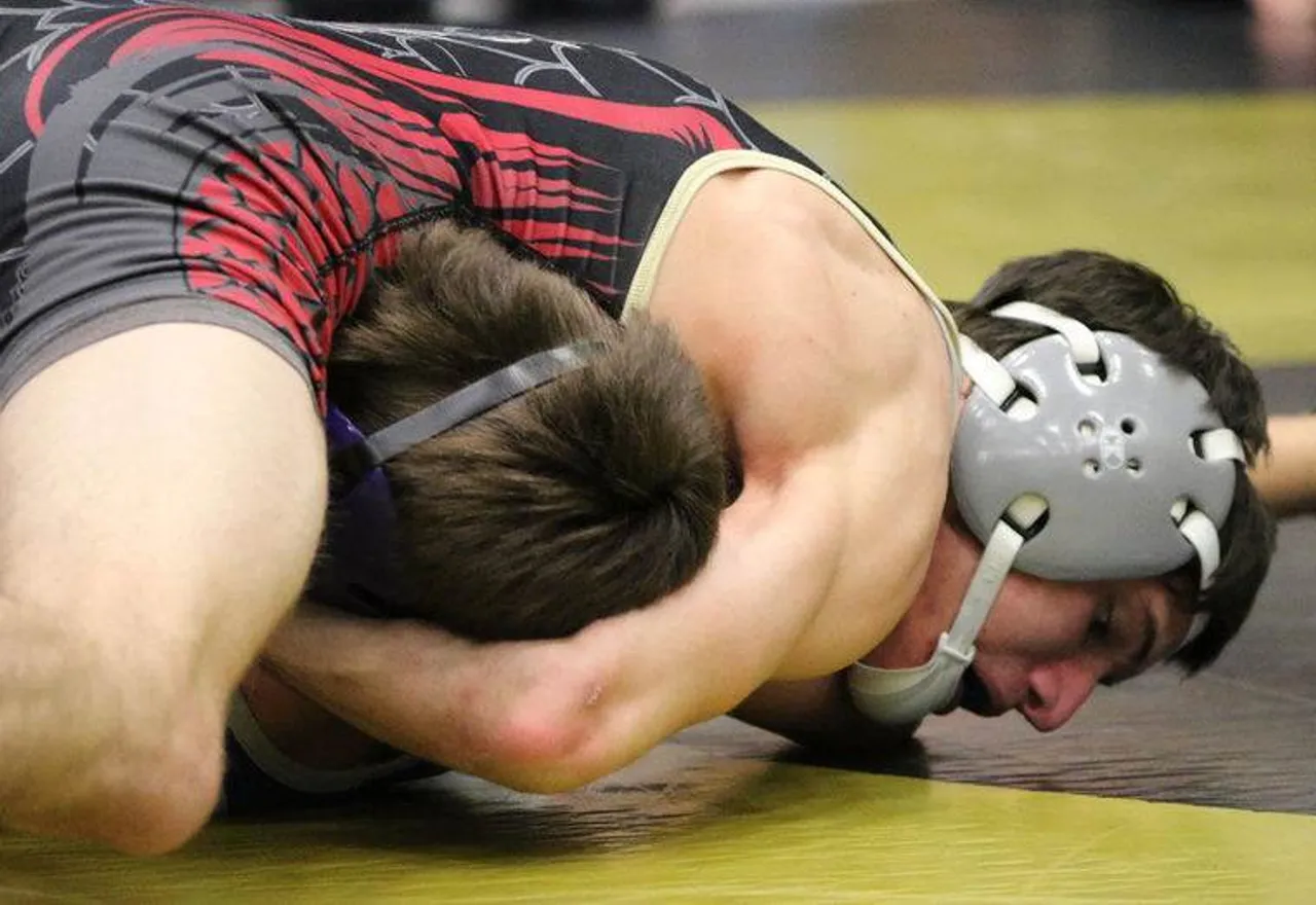 Pepperell's Brice Wade (top) works to pin freshman Dalton Blankenship during the 113-pound championship match of the Dragon Invitational on Saturday, Dec. 19, 2015, at Pepperell High School. (Jeremy Stewart/RN-T.com)