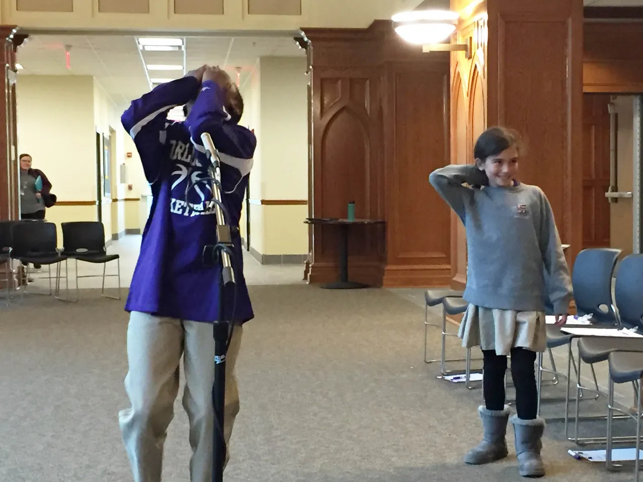 Fourth-grade student Kayo Lufadeju reacts upon learning that he is Darlington's GeoBee winner, as first runner-up fifth-grader Kate Scott looks on.