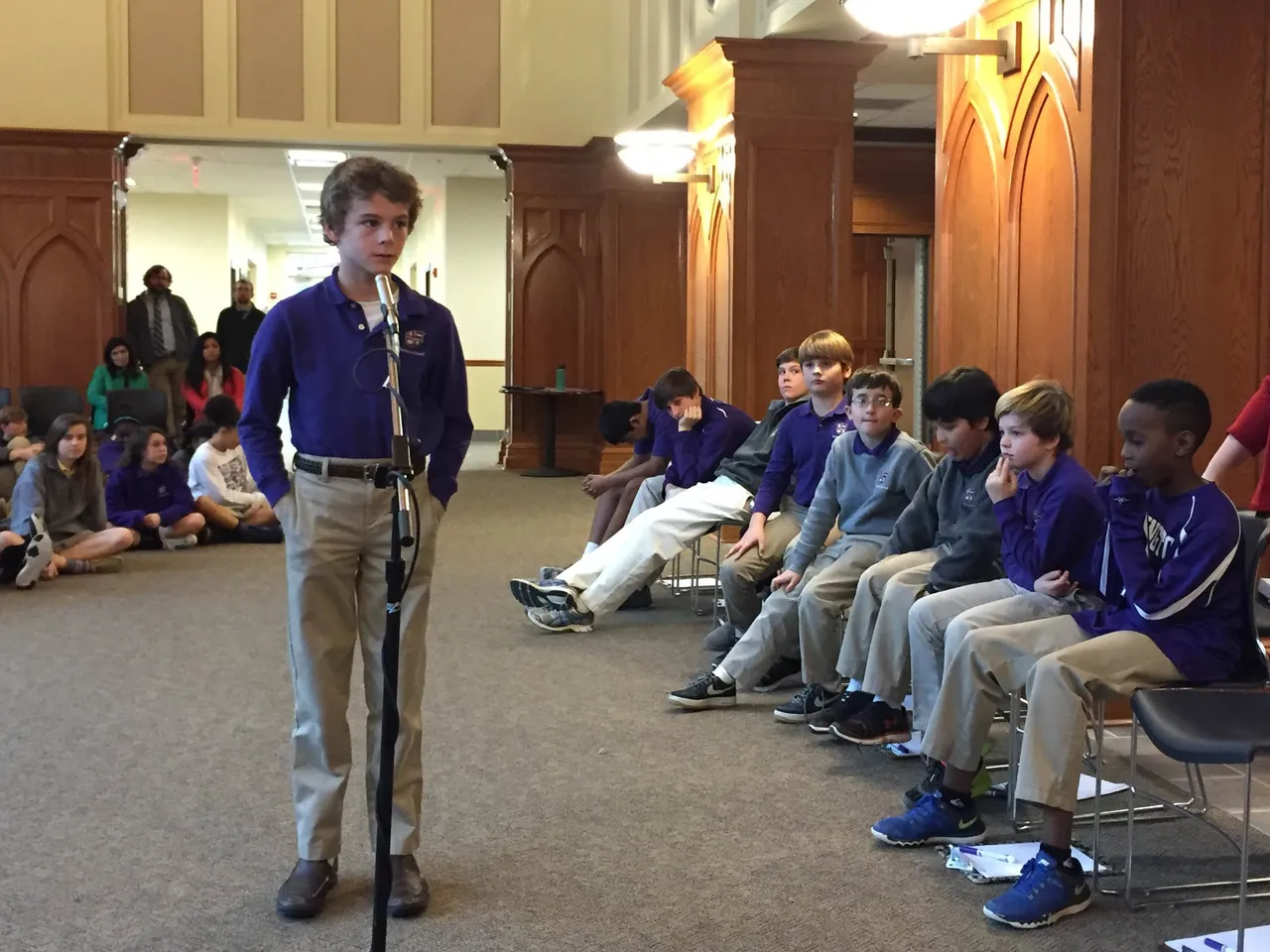 GeoBee top 10 finalist Link Lignell (4th grade) gives a thoughtful response to his question in front of fellow students and other finalists in the Ledbetter Commons.