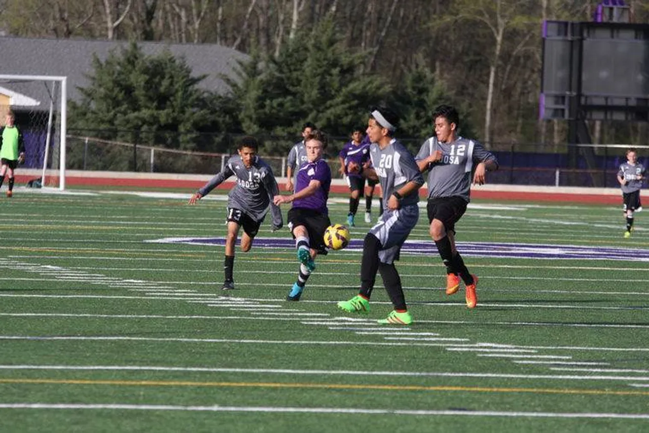 Eighth-grader Alex Liddle (second from left) takes a shot at the goal while surrounded by Coosa's Caleb Nichols (left), Jose Chavez (second from right) and Orlando Lopez during the Floyd County Athletic Association boys' soccer championship game Thursday, March 17, 2016, at Darlington's Chris Hunter Stadium. (Jeremy Stewart/RN-T.com)