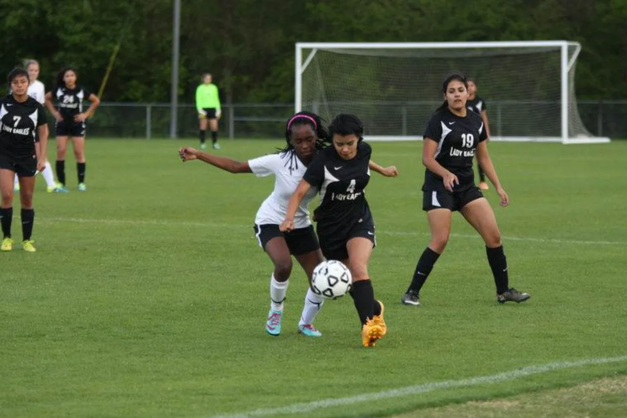 Junior Palesa Molapo battles Coosa's Yesenia Aldana for the ball during a Region 7-AA match Thursday, April 7, 2016, at Darlington. (Jeremy Stewart/RN-T.com)
