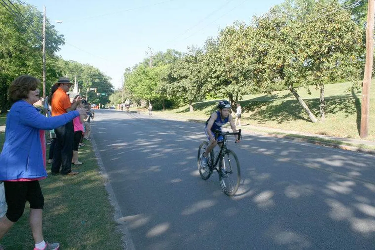Brenda Trapp (left) cheers on her grandson Nathan Medley at the Tri for the Kids triathlon Sunday, April 24, 2016, at Darlington School. (Sarah Lane/RN-T)