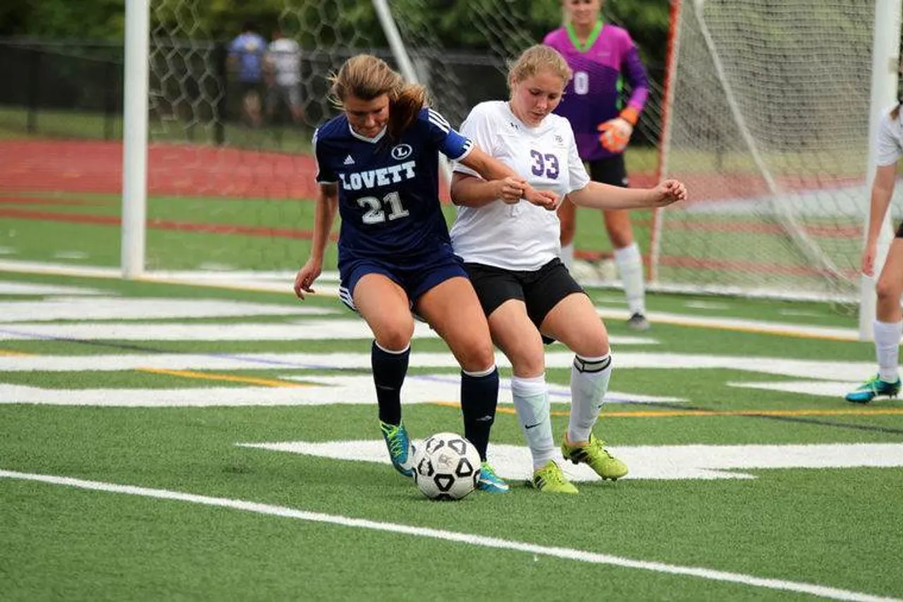 Lovett's Grace Jackson (left) and Darlington senior Zoe Smith go after the ball during a match in the first round of the Class AA state playoffs Friday, April 29, 2016, at Darlington's Chris Hunter Stadium. (Jeremy Stewart/RN-T.com)