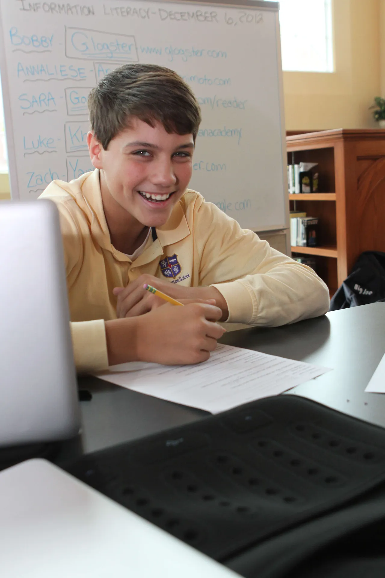All seventh-graders take information literacy, a class that teaches students how to apply 21st Century learning and research skills into their everyday class work. While learning a variety of applications and Web 2.0 tools like iMovie, Prezi, Glogster and Voki, they also learn about copyright, research, digital media, online group collaboration and project management. Here, Skyler Sledge (’17) listens to a classmate’s presentation.