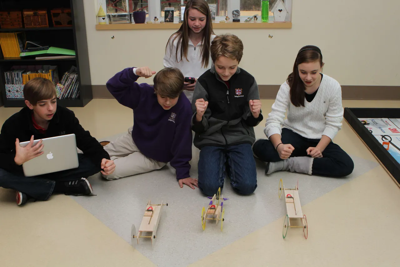 Technology is integrated into all classes in the eighth grade, including Angela Pieroni’s science class as they study motion. Students formed groups; came up with business plans; assigned roles such as researcher and presenter; built prototypes; and measured and presented results. Final projects were shared with the class in the format the students thought most appropriate, including presentations and movies. Here, Cooper Brock (’17), Gamble Shadday (’17), Annaleise Clevenger (’17), Henry Fields (’17) and Katie White (’17) race their model cars.