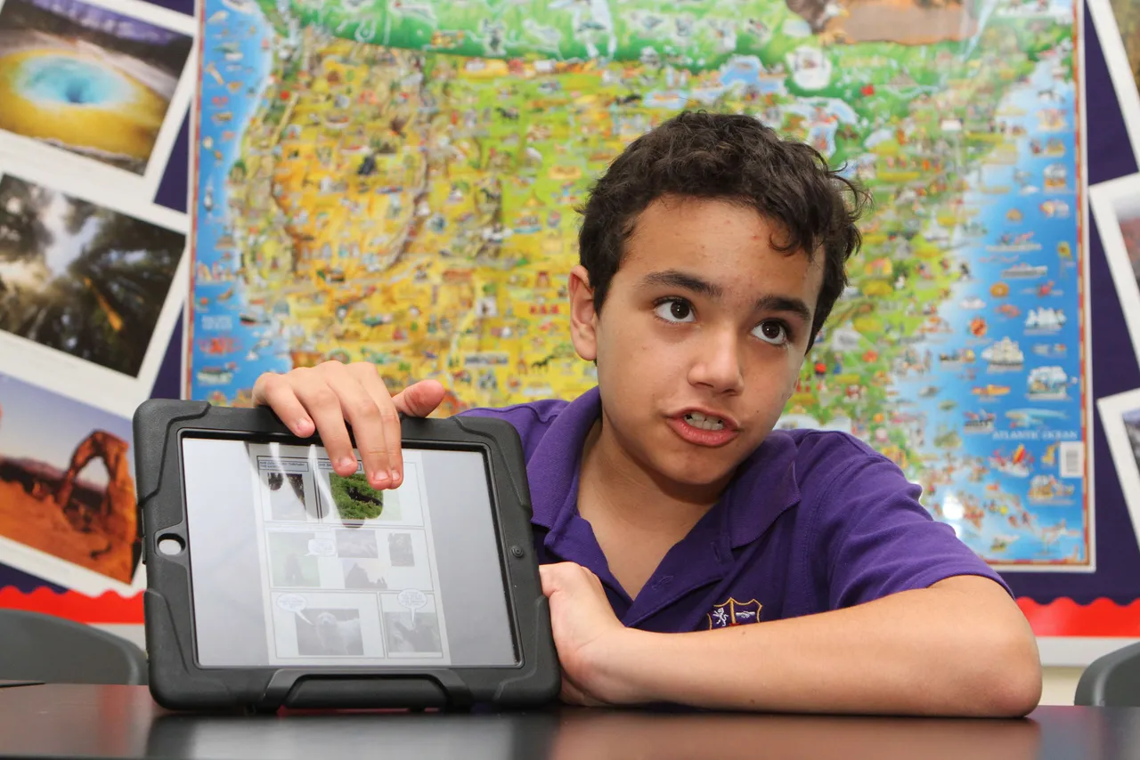 Sixth-grade teacher Chris Babb makes science relevant through a year-long national park study in which students each pick a different park and connect it to their current science topics. So far, students have made Keynote presentations on park history, promotional commercials using iMovie, and partnered with pre-K students learning geography to make park posters. Here, Nicolas Seijo (’19) presents a comic book story, made using the Comic Life app, set in Olympic Park, which included facts about the park.