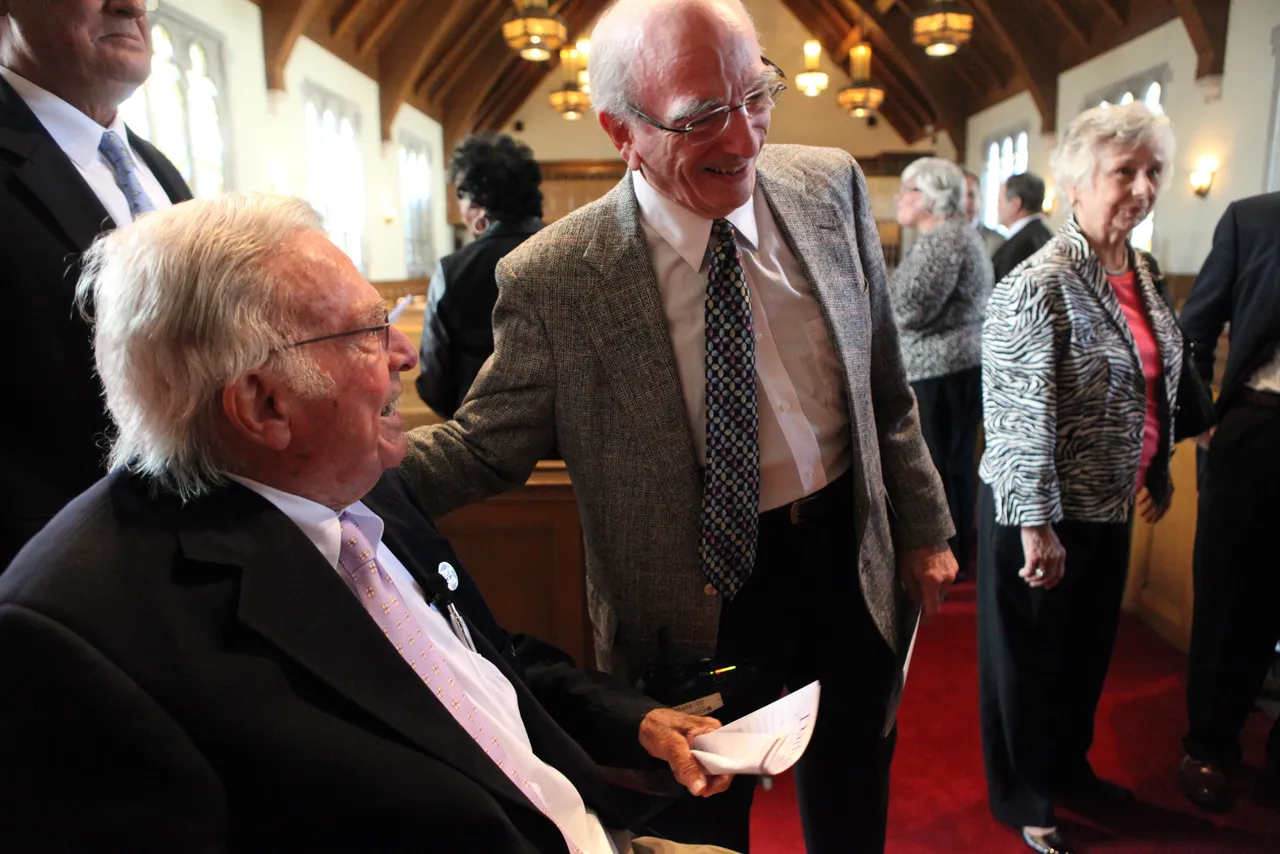Friends congratulate Gardner Wright ('47) after he receives his award at Darlington Celebration.