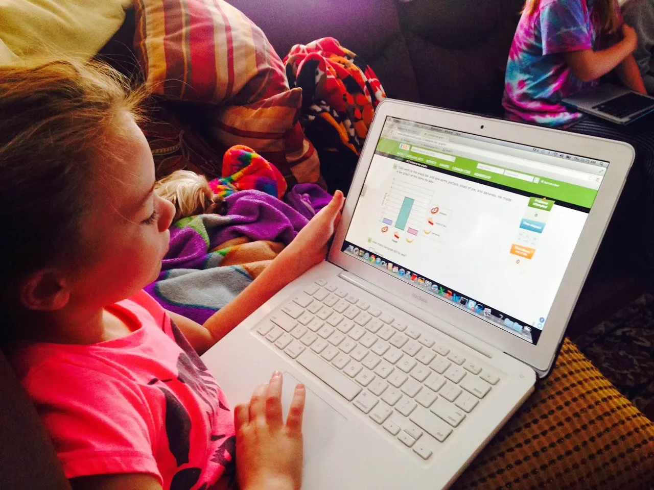 First-grader Emma Hunt works on distance learning in math.