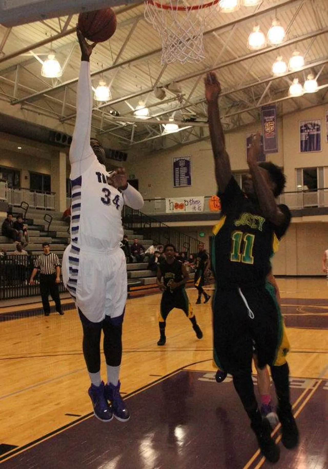 Gboyega Adeyeye (34) lays the ball up against T.W. Josey High School at Darlington on Saturday, Jan. 10, 2015. (Photo credit: Sierra Campbell/Rome News-Tribune)