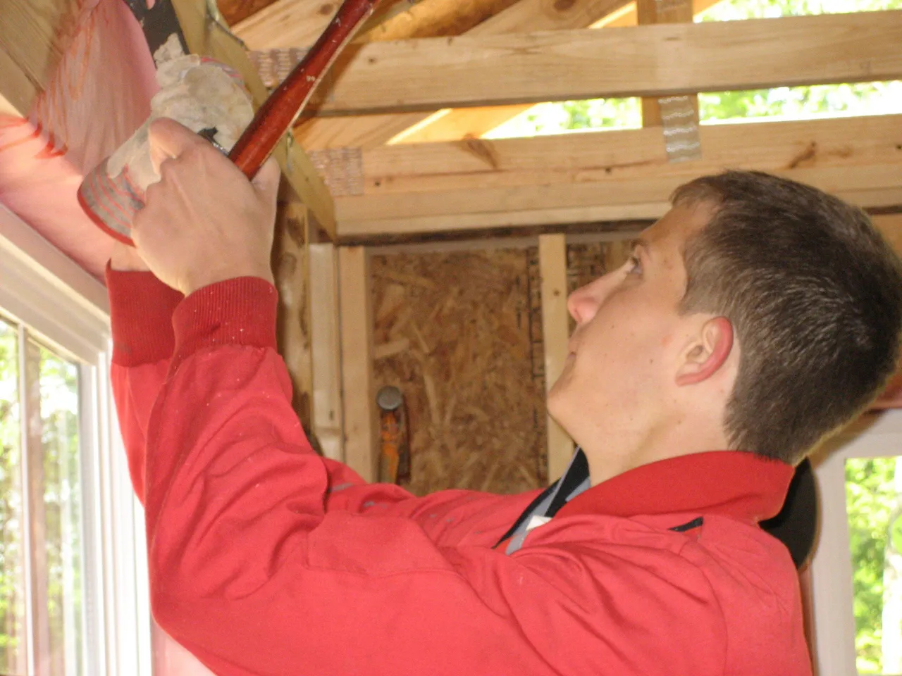 Norman Bonnyman ('07) works at a Habitat for Humanity house