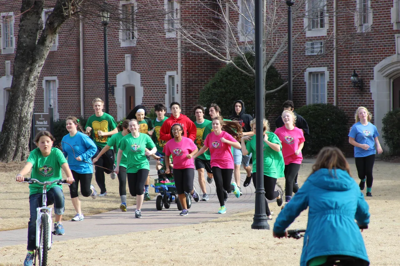 Boys from Neville and Moser House run with the Cooper House girls in "Build It!"