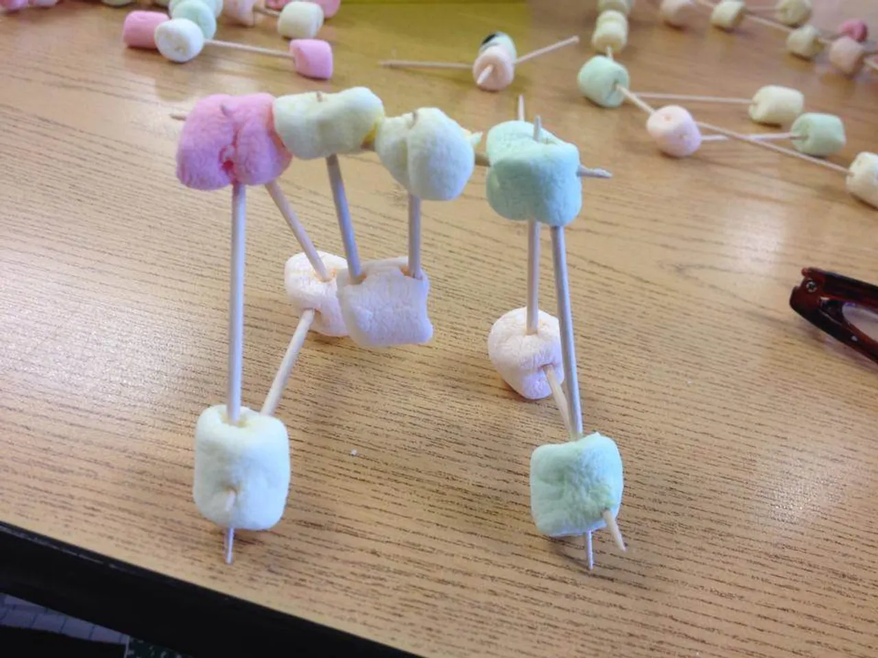 In the afternoon, we did 100 Day centers with pre-K, kindergarten and second grade. In Mrs. Watkins' room, we used toothpicks and mini marshmallows to construct something. I made a swingset!