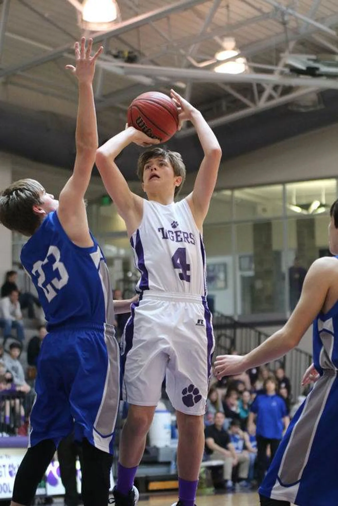 Seventh-grader Griffin Brewster (right) shoots over Armuchee’s Jacob Stanley. (Photo credit: Tyler Greenawalt /RN-T)