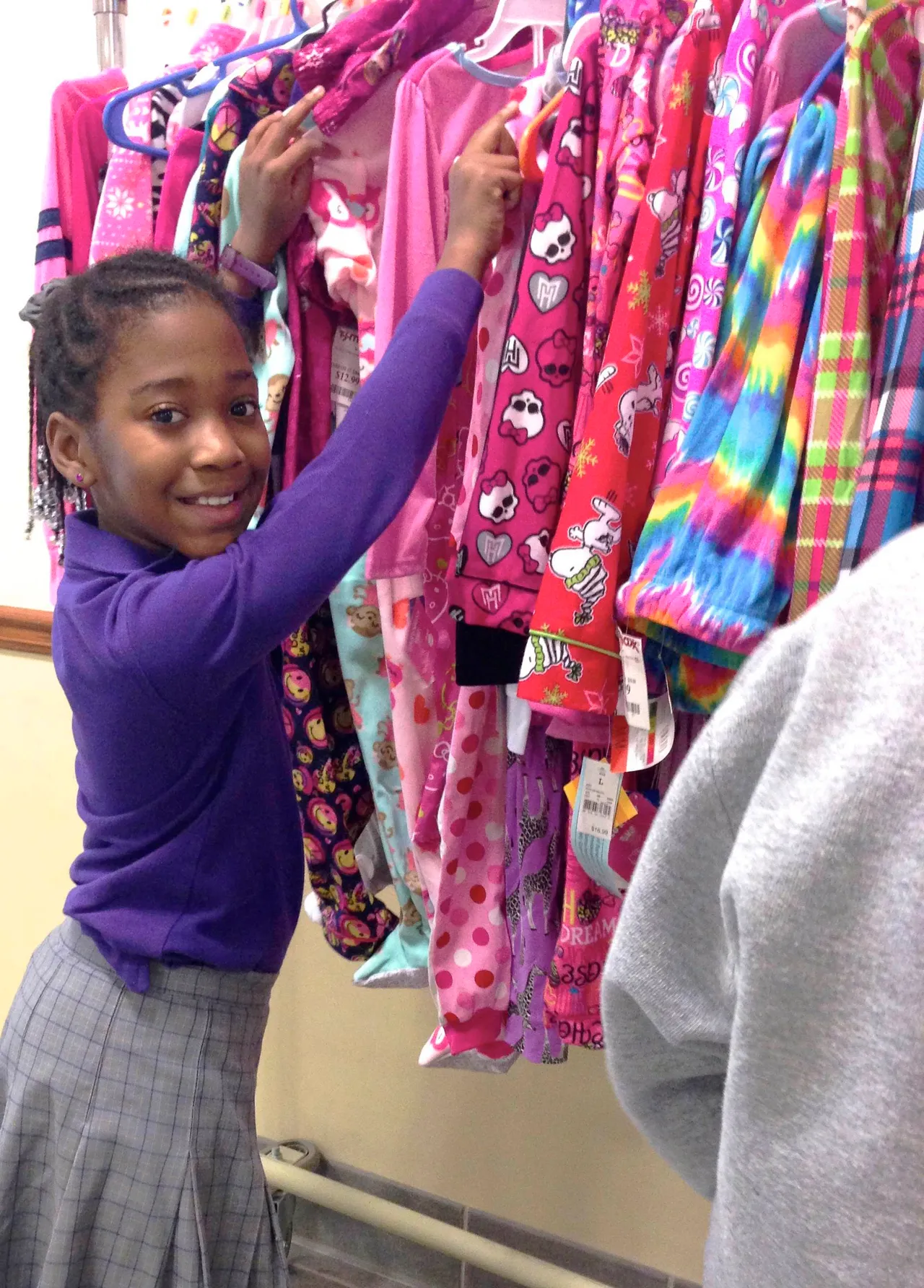 Fourth-grader Christa Twyman sorts through items collected during the Pajamas for Foster Kids drive.
