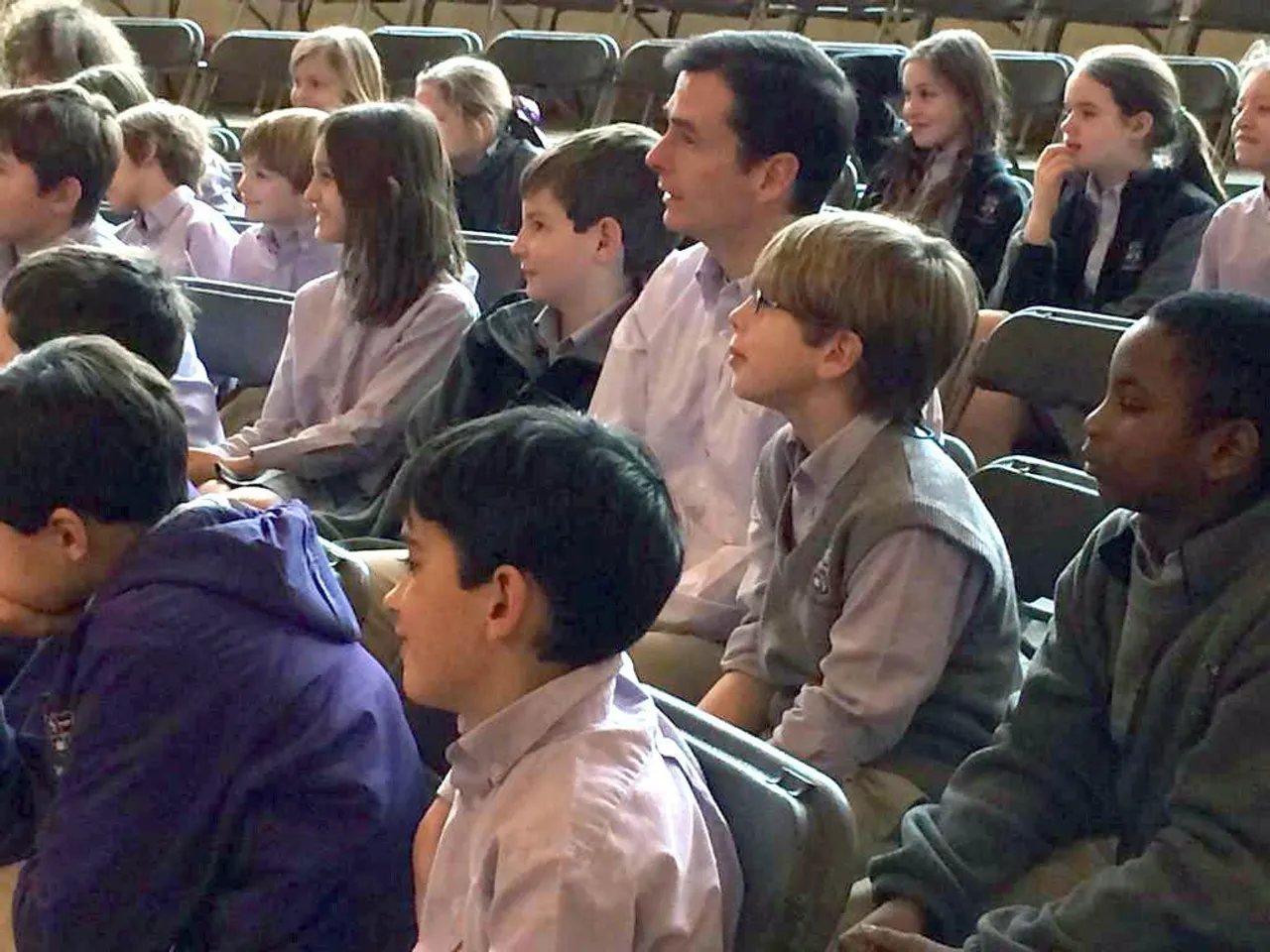 Taking in assembly with classmates, we learn the difference between pride and boasting from Mrs. Z.