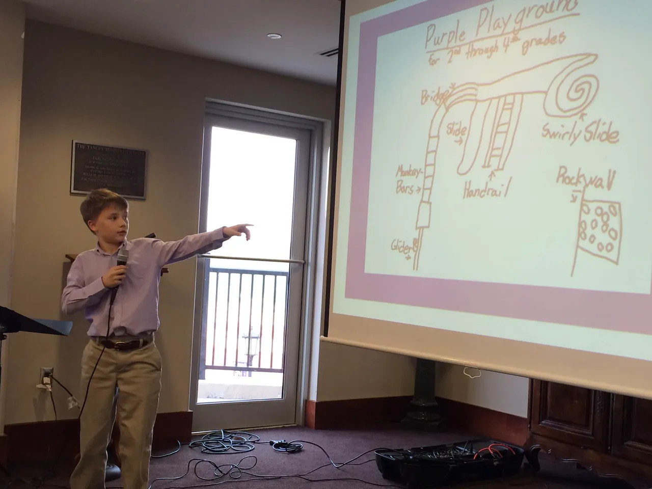 Fourth-grader Connor Brown notes some of the focus group's favorite features of the "purple playground" at the Thornwood campus.