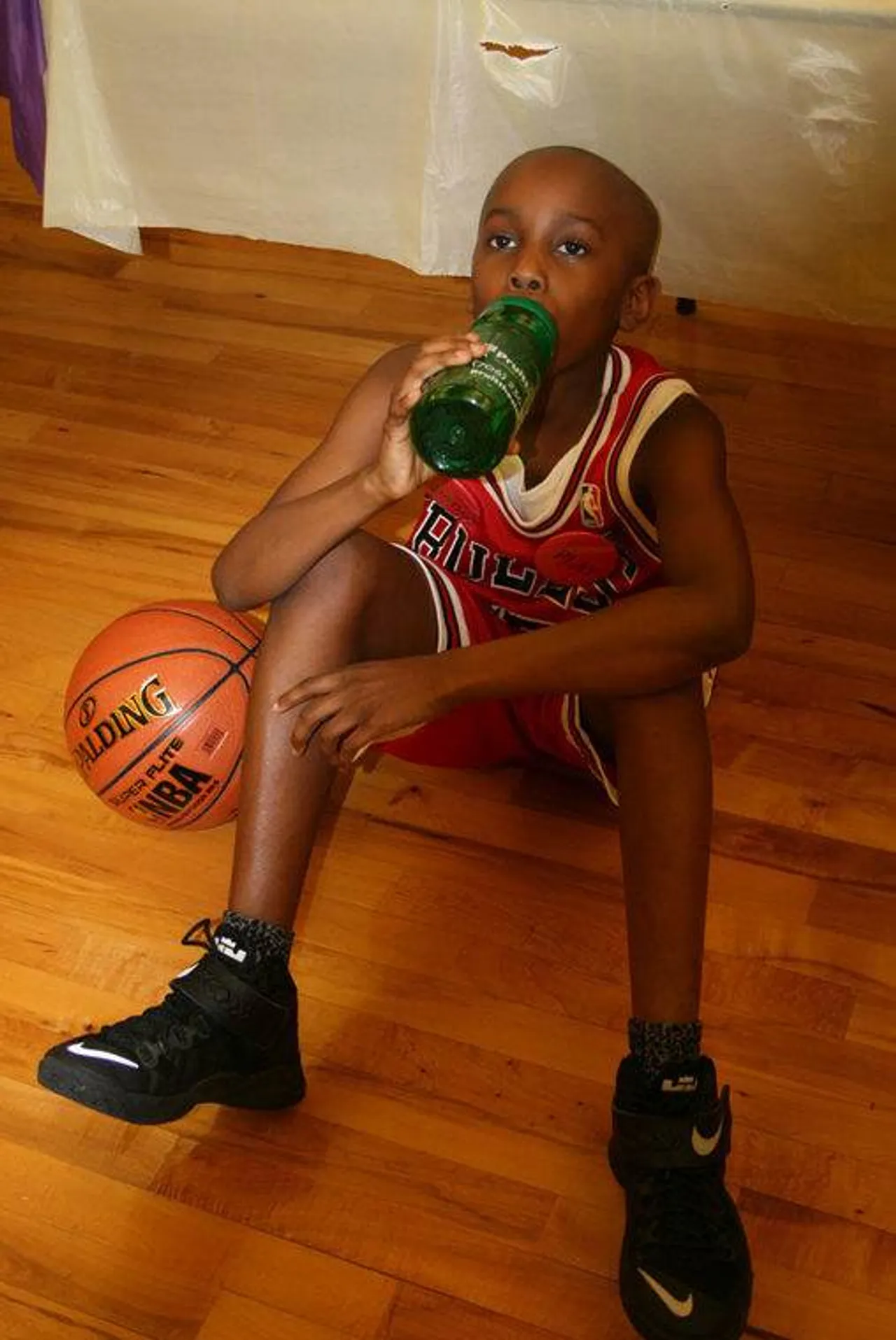 All the talking the students have to do during the Wax Museum is thirsty work. Kayo Lufadeju as Michael Jordan takes a much-deserved water break. (Photo credit: Kristina Wilder / RN-T.com)