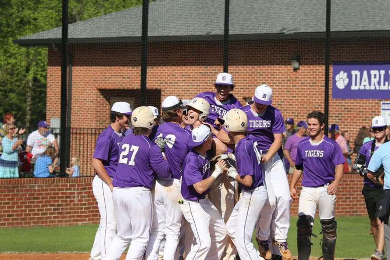The Darlington Tigers celebrate Burton Dulaney’s walk-off home run that gave Darlington a 1-0 win over Model. (Photo credit: Tyler Greenawalt / Rome News-Tribune)